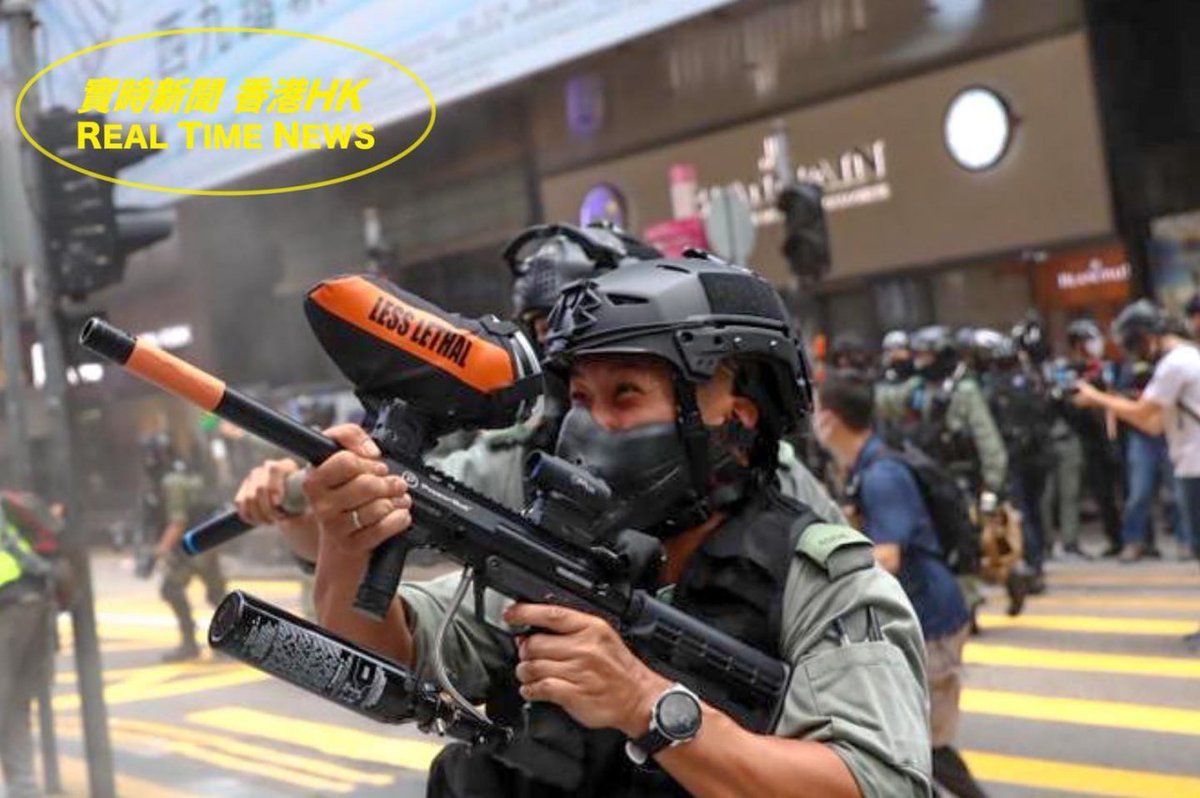 VerbatimHKG's tweet photo. Asia's finest: riot police seen joyfully shooting at protesters this afternoon. 

Riot police laughed hysterically as he fired pepper ball rounds to the crowd. You can see his heightened excitement through his eyes.

Source: Real Time News HK

#PoliceBrutality #HongKongProtests https://t.co/wij7njIAbb