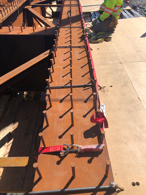 Physical distancing while working at heights requires an innovative approach. We're using a horizontal lifeline system, which allows the crew to travel along the structure working on overhangs and be protected under fall protection regulations.

tomlinsongroup.com/company/health…