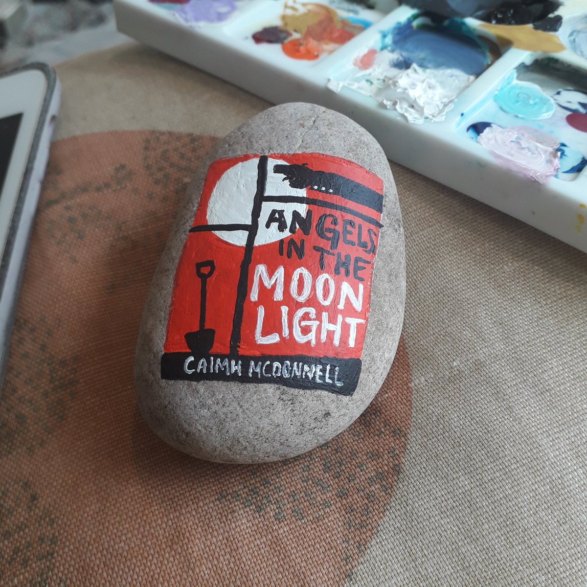 Angels In The Moonlight by  @Caimh McDonnell, part of one of the funniest sets of books I've ever read. Painted on a rock.