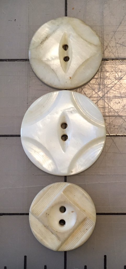 This is kind of neat: the same motif in shell (top), glass (middle), and plastic (bottom). Front and back.