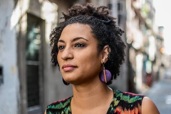 this is marielle franco. shes was a politician and activist who fought for women, black people, lgbtq+ causes... she was murdered in cold blood by her politic views. by who? we still have no idea. no one was held accountable.