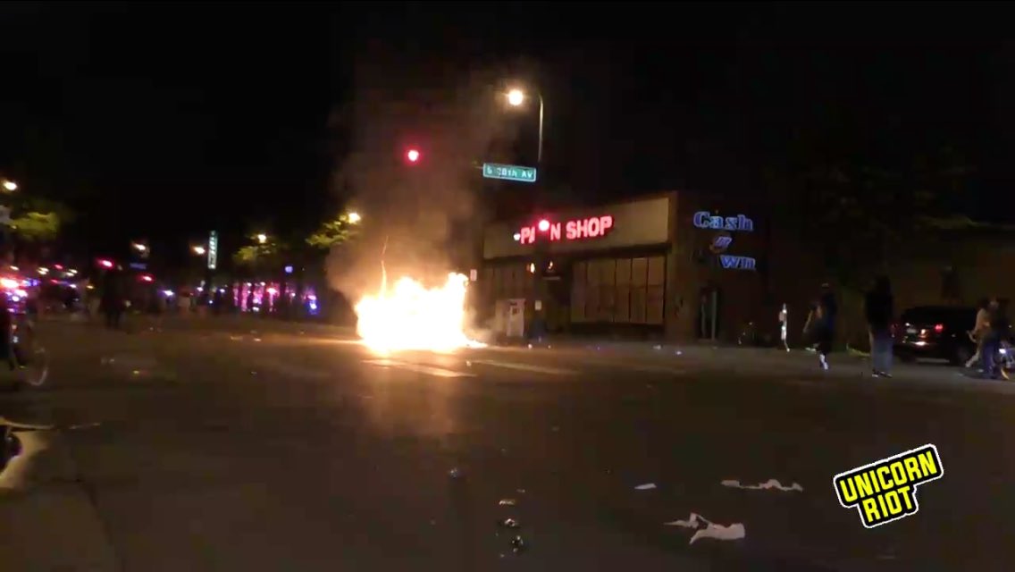 Dumpster fire burning brightly by the pawn shop near MPD 3rd Precinct bldg