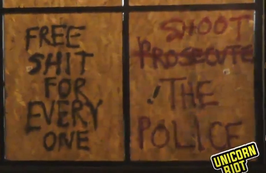 Graffiti on boarded-up windows near the Minneapolis Police 3rd Precinct. The rage at  #GeorgeFloyd’s murder shows no signs of dying down