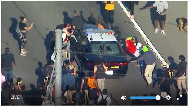 Here's a screenshot we were able to obtain from the livestream. One person was injured. Protesters are still taking the freeway.  #LAPD  #BlackLivesMatter    #GeorgeFloyd  #LosAngeles