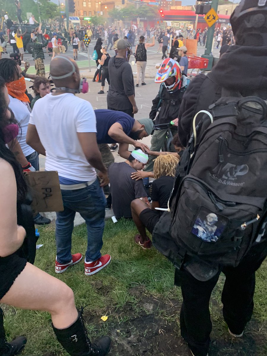 Young man named Mason said he was hit by a rubber shot from police. People clapped for him as he took a seat. He says he’s fine. Others helping cover his wound.  #GeorgeFloyd