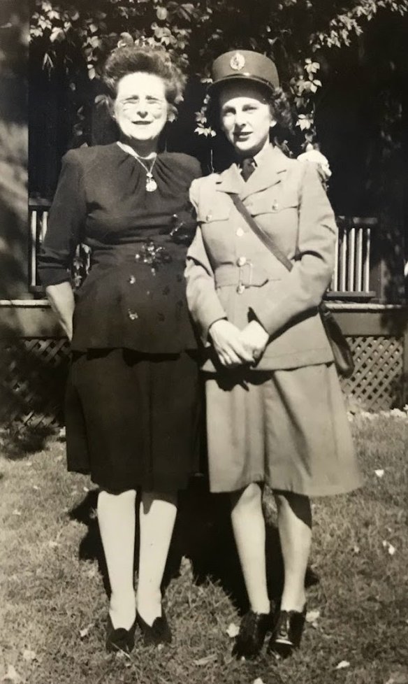 At some point, Veryl joined up.Does anyone recognize her uniform?Here she is with her mother. In the group shot, Veryl is on the far left.