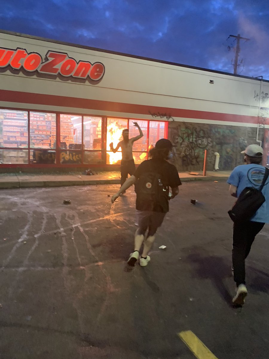 AutoZone at the corner of Minnehaha and Lake has a fire burning inside of a broken window. The store is right across the street from the police station.