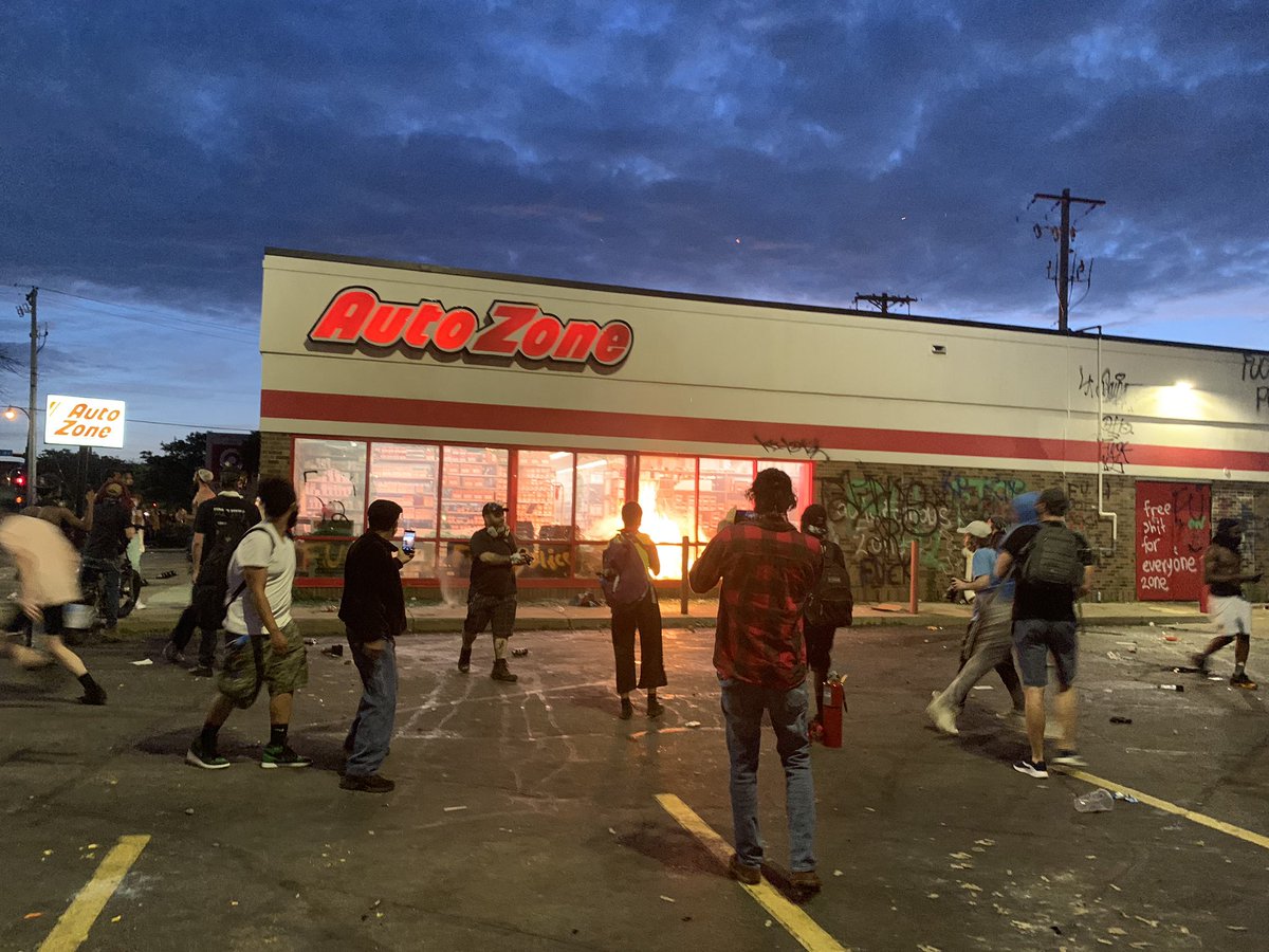 AutoZone at the corner of Minnehaha and Lake has a fire burning inside of a broken window. The store is right across the street from the police station.