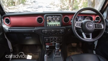 The Jeep has front and rear lockers, as well, running through a rocker switch that effectively locks all four wheels together; part-time 4WD means there is no centre differential that needs locking.
