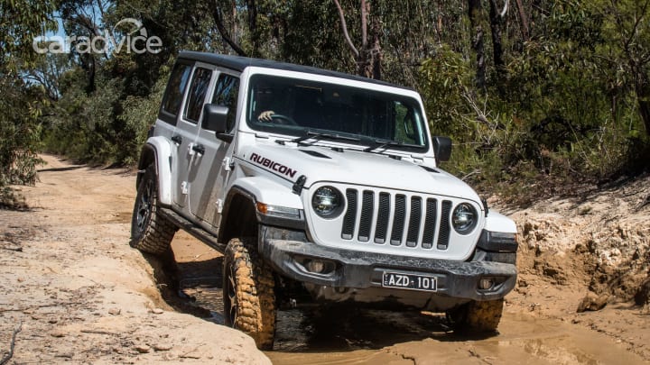 The Jeep has front and rear lockers, as well, running through a rocker switch that effectively locks all four wheels together; part-time 4WD means there is no centre differential that needs locking.