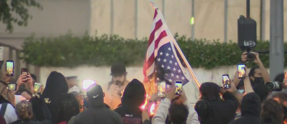 UPDATE: Police confirmed no arrests were made in the George Floyd demonstrations which shut down the 101 Freeway in downtown L.A. Wednesday. A group was seen burning an American flag, and the front sign at LAPD headquarters was defaced with graffiti. cbsloc.al/2ZLQ5os