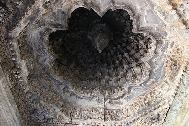 4/n The rows of shining lathe turned pillars that support the ceiling of the mantapa is a Hoysala-Chalukya decorative idiom. The mantapa has many deeply domed inner ceiling structures adorned with floral designs and when in floral there was a depicted with Natarajan image.