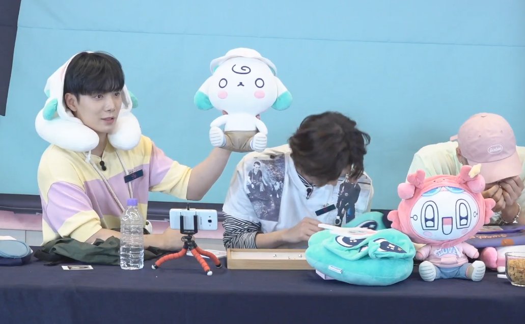 JR: "I read a comment asking if you can take the plush's clothes off so I tried. You can take the top off but I don't recommend it because it's really hard to put back on." #뉴이스트  #NUEST  @NUESTNEWS