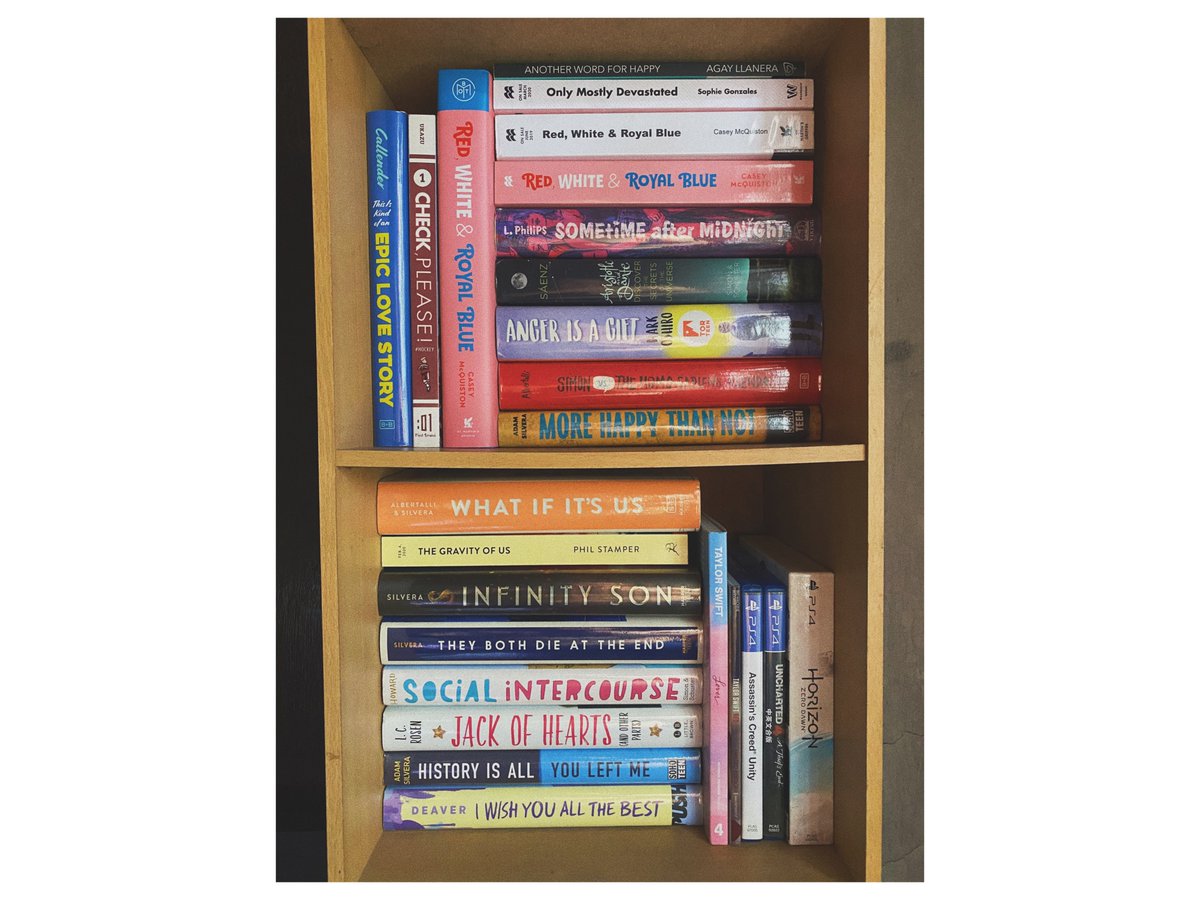 I also took a picture of my other shelf that mainly features LGBTQ+ novels. (Yes, I have four copies of Red, White & Royal Blue, the audiobook included. What about it?)