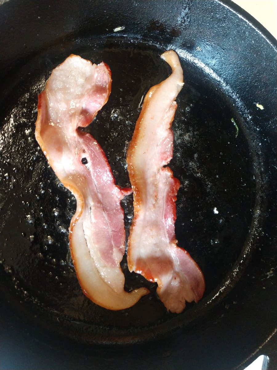 Next step is optional but usually standard when I cook. Fry a couple of strips of bacon, primarily to render lard to cook the burgers in. If you like bacon on your burger, add it later. Or have as a side snack.