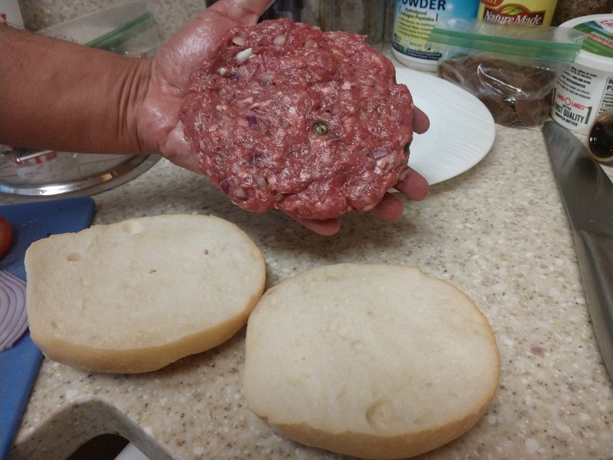 Next we take the bacon out and start cooking the burger in that delightful pig fat. Remember to make the patty slightly bigger than your bun cos burgers shrink. We like Kaiser rolls as buns so this is a big 1/3rd pounder that wife and I will share.