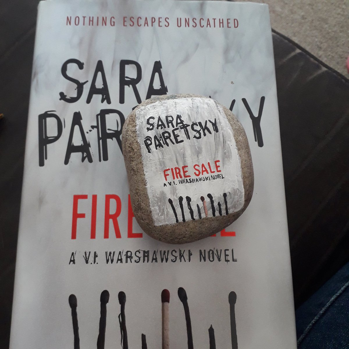 A little VI Warshawski on a rock. I've been following this series for 20 years. Fire Sale by  @SaraParetsky painted on a rock to be hidden in my library