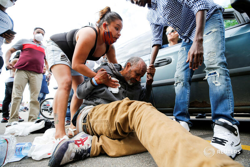 A man injured after being hit in the head by an object at a protest near the Minneapolis Police third precinct. More photos from last night's demonstrations over the death of George Floyd:  http://reut.rs/3db5SAJ   Eric Miller