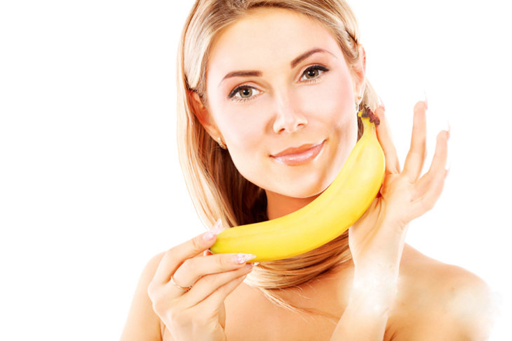 (2/10)This woman is very happy to be holding a very fresh, perfectly ripe banana. The elegance of this shot is further enhanced by the perfect, unblemished skin of both the woman & the banana.