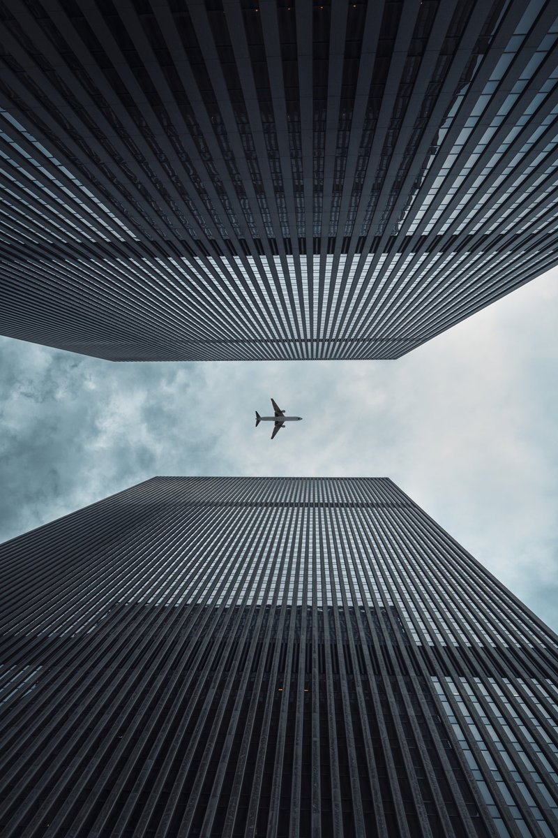 Plane between the buildings- New-York