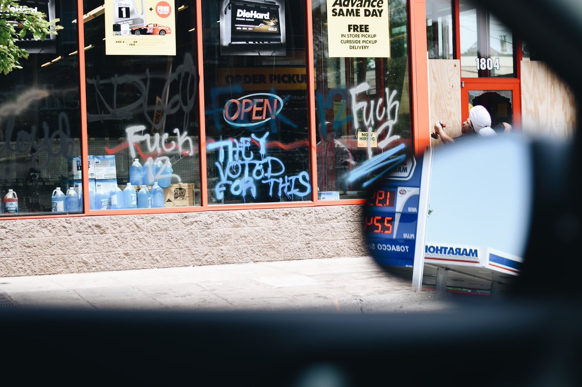 First photo is of protestors spray painting where George Floyd was killed