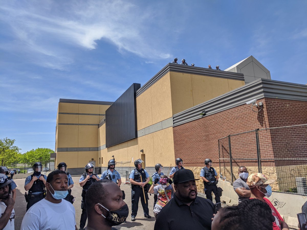 For those asking where the cops are, they are across the street protecting the 3rd precinct police building from a large crowd that's right outside.