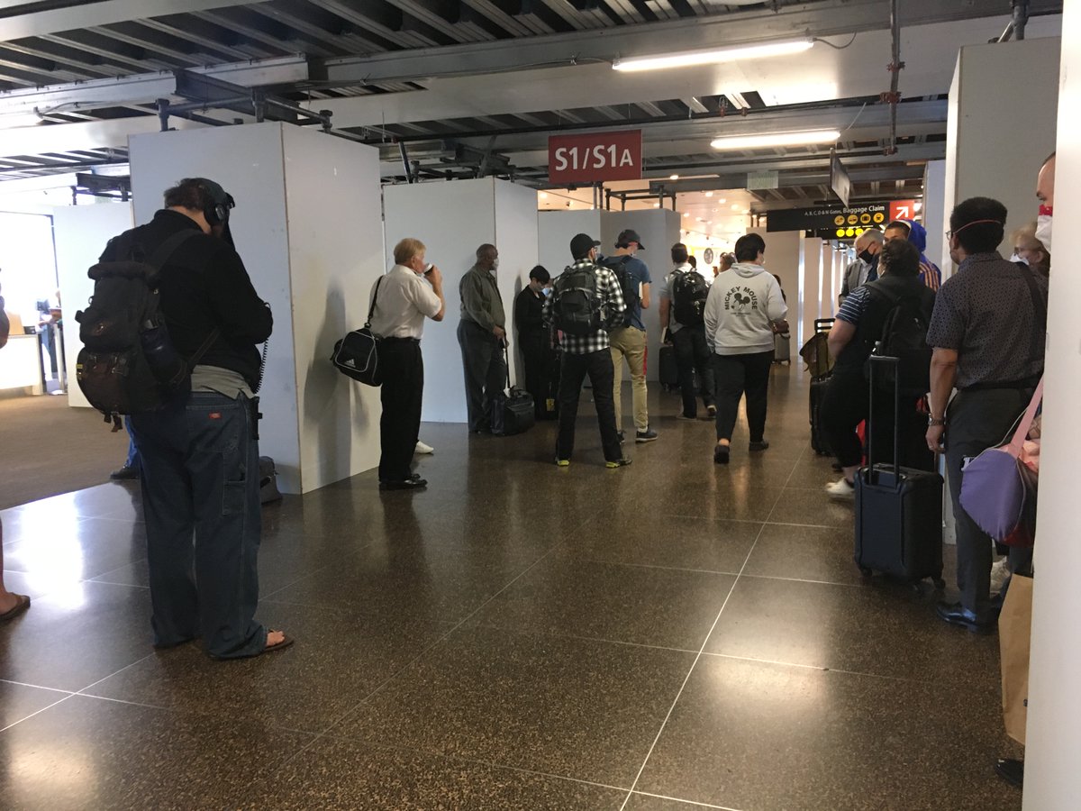 Each individual business in the airport has dutifully painted its little social distancing footprints in front of it, for queueing, but no thought has been given for how to keep crowding down globally (or even laterally in the queue). Random construction makes the situation worse