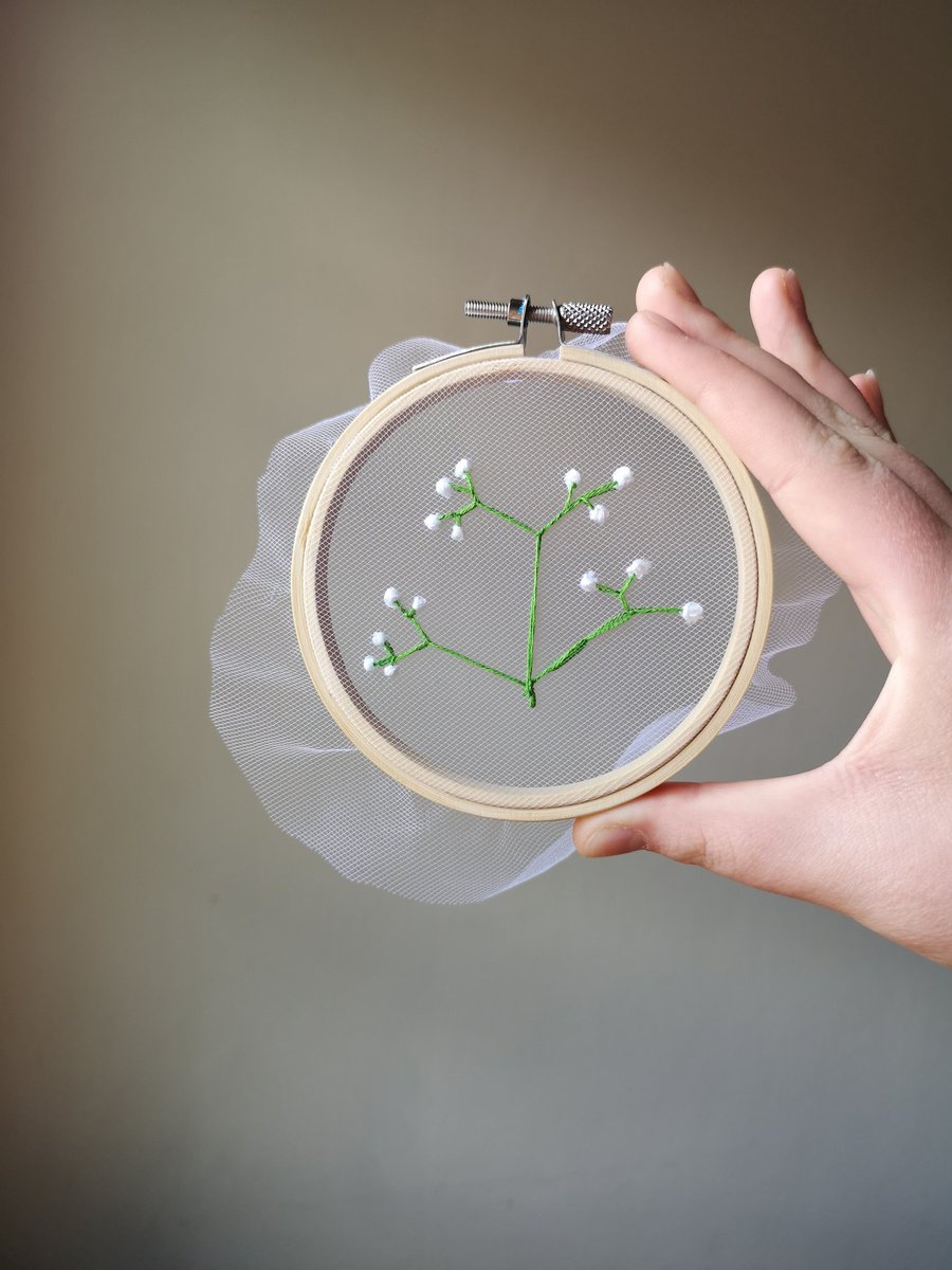 Delicate baby's breath stitched onto tulle