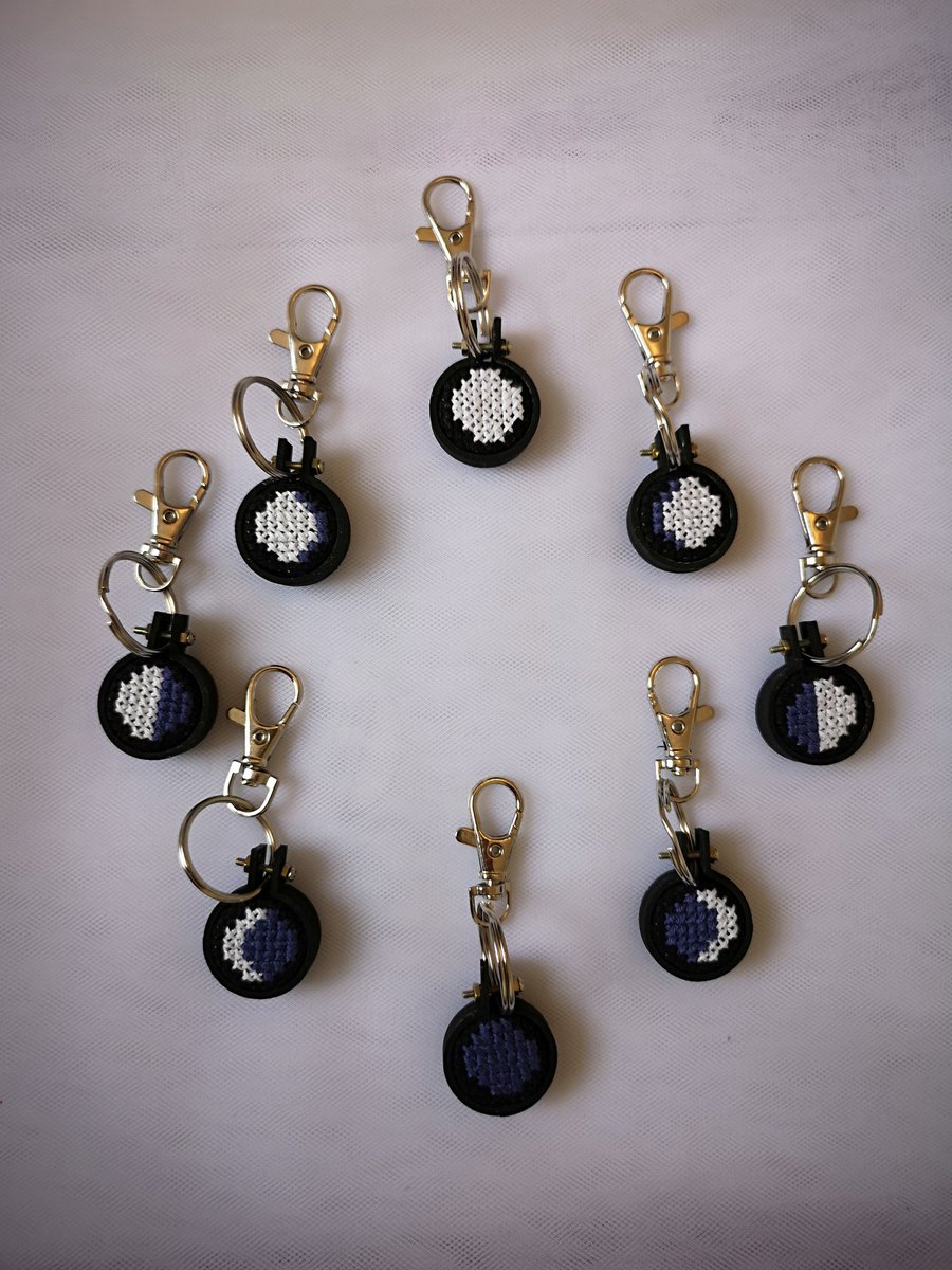 Moon phase keychains! These are on silver clasps but the light gave them a gold look