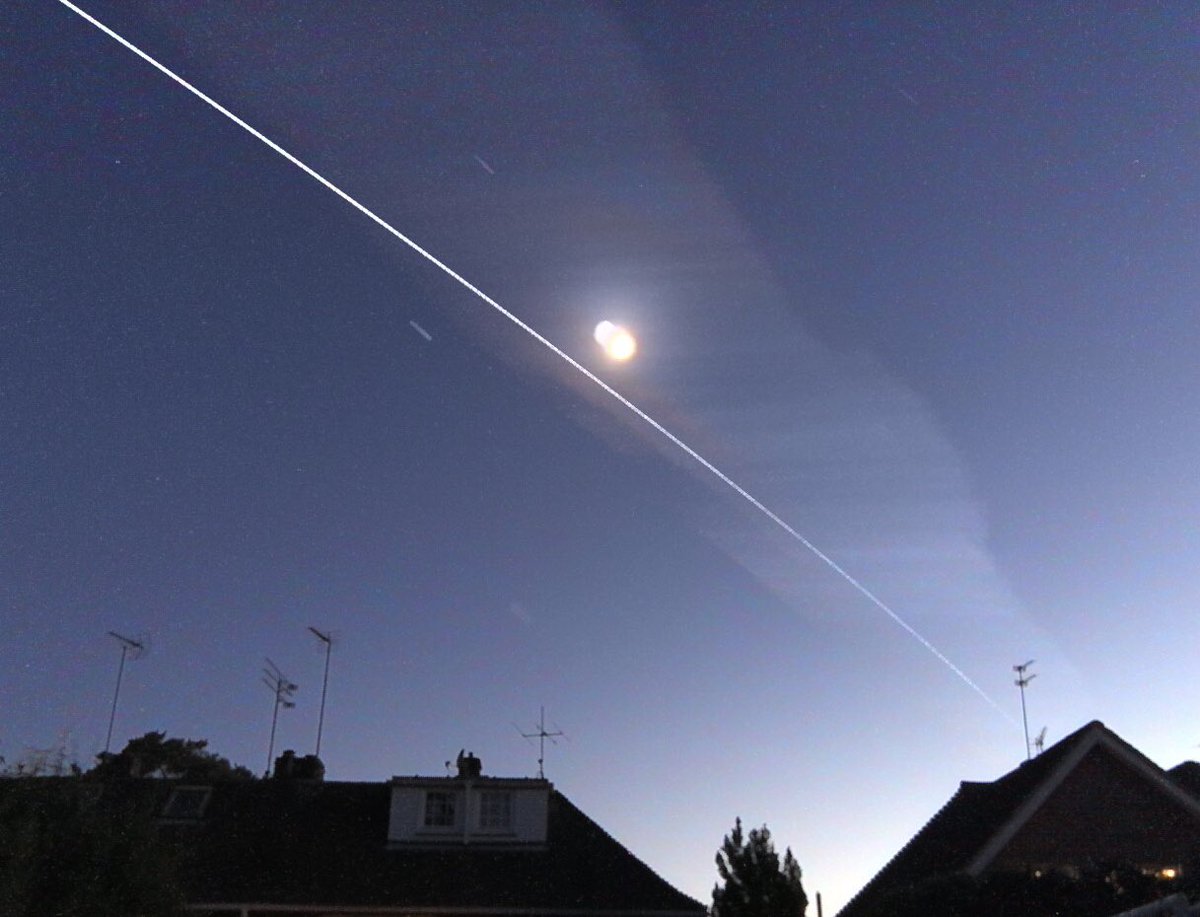 jonnerssearle's tweet photo. @VirtualAstro @Space_Station #ISS framed by an aircraft vapour trail over Sunningdale tonight. 3 new junior stargazers loving the passes this past week! https://t.co/EPCBPXa8OE