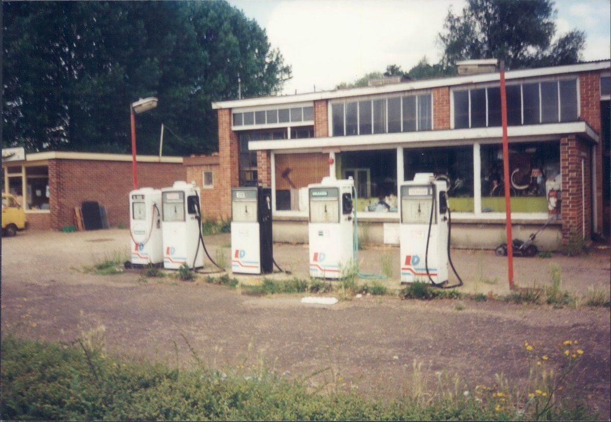 Day 158 of  #petrolstationsLittle David, Hillside Garage, Bungay, Suffolk 1995  https://www.flickr.com/photos/danlockton/15644241613/  https://www.flickr.com/photos/danlockton/16264139085/Lovely 1995 scene with Commer Spacevan, dandelions, and an attractive post-war building with huge windows—luckily it's survived  https://hillside-garage.com 