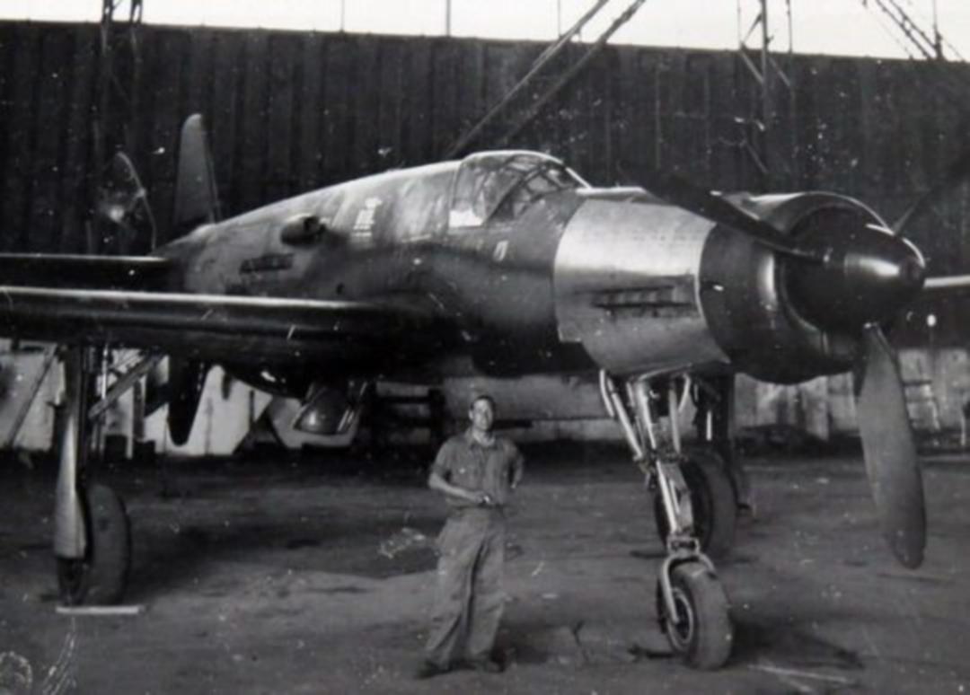 Here's the problem:The propellor on the tail required a fin on the underside to prevent the propellor from hitting the ground on takeoff.The fin required the longest landing gear ever put on a fighter. A six-foot-tall man could walk under the aircraft without ducking.