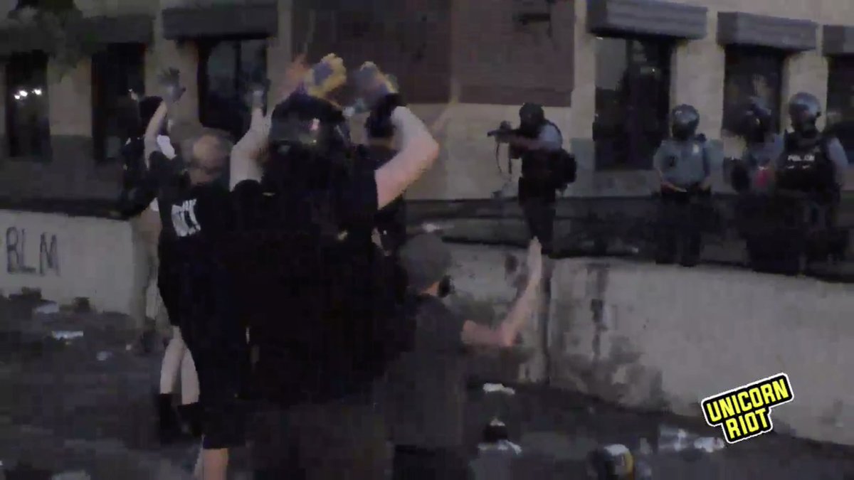 theagathion's tweet photo. Cops are shooting 40 mm rounds while protestors have their hands up. You can hear them shooting and hitting things despite the risk of accidentally hitting peaceful protestors. #poortraining #minneapolisriots #GeorgeFloyd #icantbreathe https://t.co/ao4MrPDul8