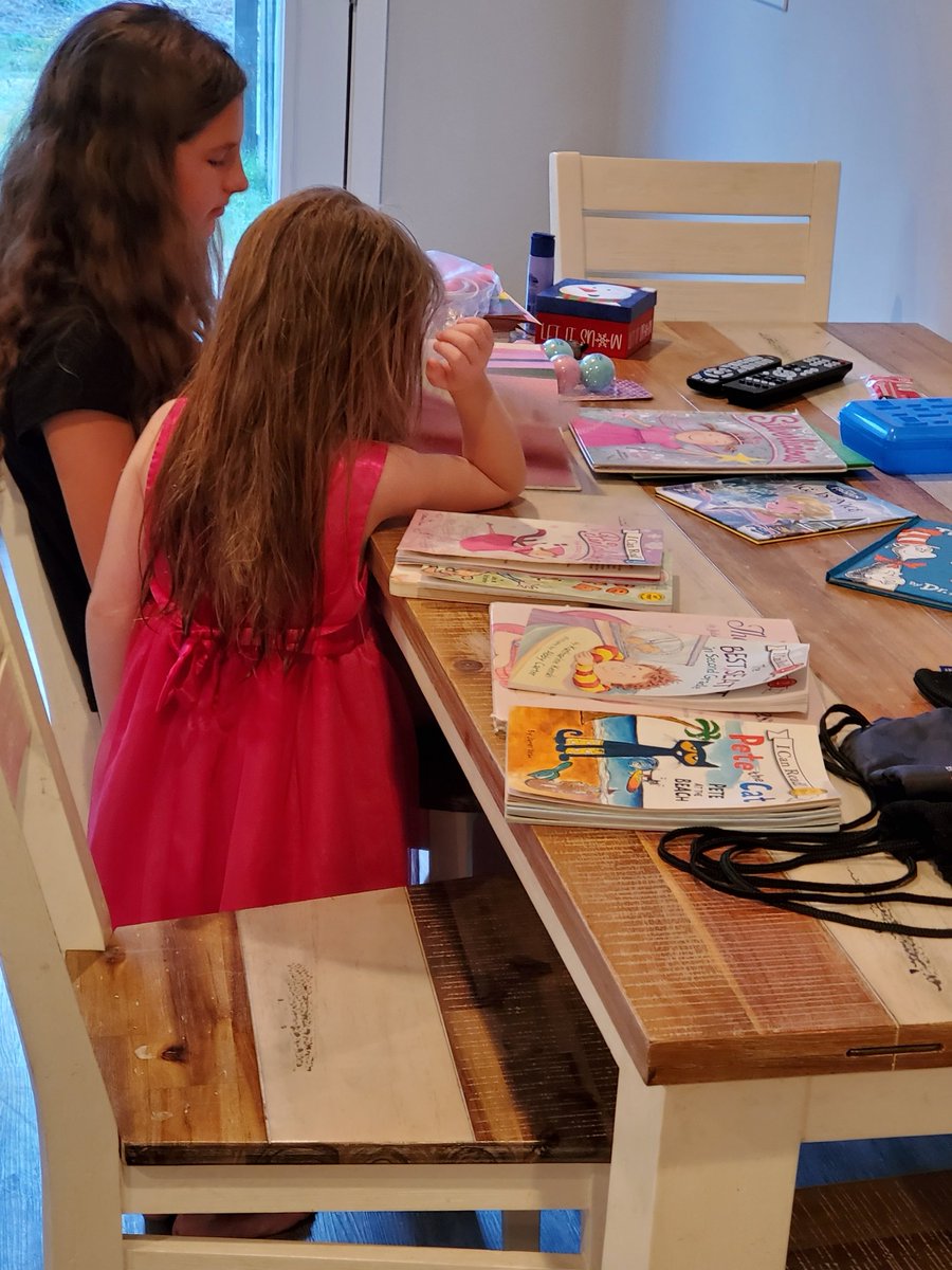 Here I am...Lovingly watching my oldest daughter help with my youngest daughter's groundingShe had to read at the table until dinner. Cute smiles got an 'older sibling exception' approved