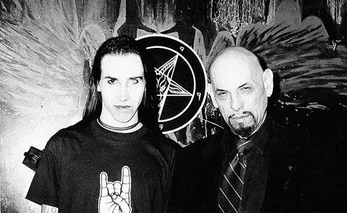 Jay_Ordog's tweet photo. @_Discernment_ @intheMatrixxx The image of Kerry "with" Anton LaVey is fake. It's a photoshop mash up that uses a photo of John Kerry greeting the clown Rami Salami in 1998, and a photo of Anton LaVey posing with rocker Marilyn Manson in 1994. I would however agree that clowns are creepier than LaVey. https://t.co/I6wT1d2zip