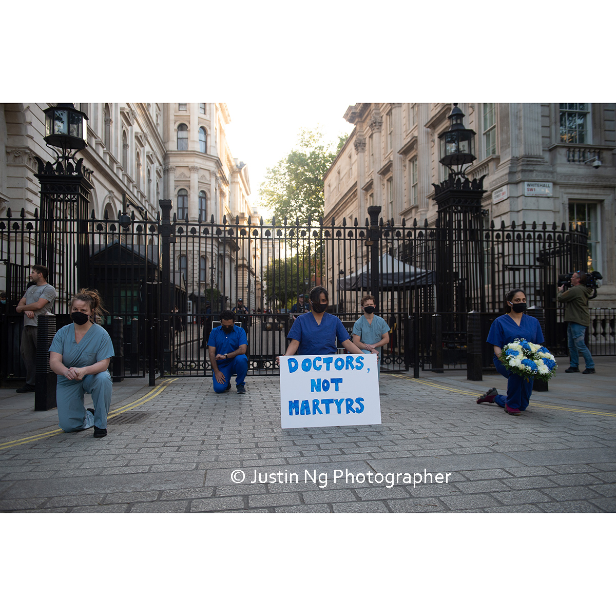 justin_ng's tweet photo. NHS staff took part in a silent protest outside Downing Street last night for #ClapForCarers https://t.co/IGVLxGwmAm