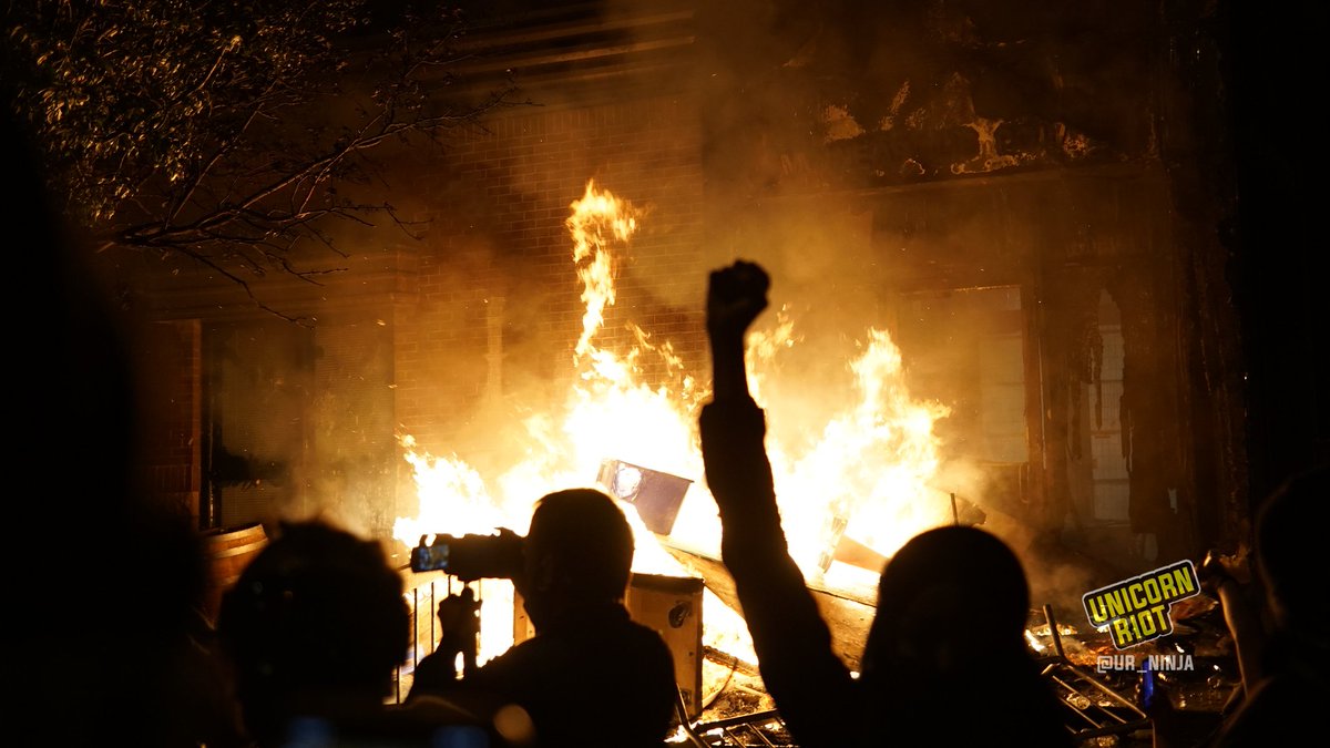 The  #3rdPrecinct was burning steadily at ~11 p.m. last night. The grounds were covered with graffiti, while the building was occupied inside all the way to the rooftop.Spray-painted on a barrier is the phrase "Burn The MPD" #GeorgeFloydProtest