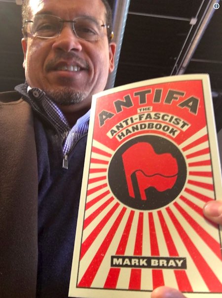 bennyjohnson's tweet photo. The Attorney General of Minnesota 
and Antifa sympathizer, @keithellison posted a video to Twitter and asked his followers to “ID him” which has led to hundreds of users posting personal information about people, including police officers, falsely identifying the person. https://t.co/G0AtTXJmnN