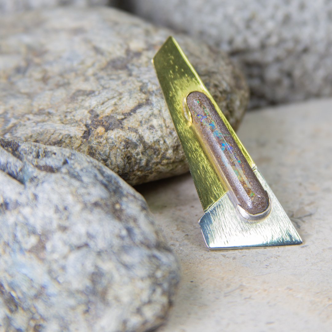 The final reveal. The Boulder Opal Chevron brooch made from Brass and Sterling Silver and set with a lozenge of Boulder Opal.

It is available from my website davidjlilly.com

#handmadebrooch
#silverbrooch
#sterlingsilverbrooch
#showmeyourbrooches
#mensbrooch
#gemstone 
#