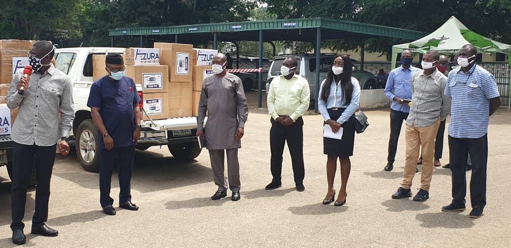 Azura staff making a donation of medical supplies and masks to the Edo State Govt.