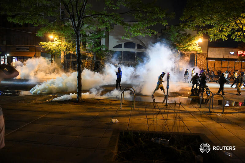 Protesters outside the Third Precinct police station briefly retreated under volleys of police tear gas and rubber bullets fired at them from the roof, only to regroup and eventually attack the building, setting fire to the structure as police withdrew  https://reut.rs/3etMLSJ  3/3