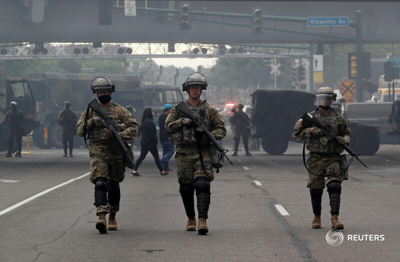 National Guard members and armored vehicles are seen in the area after a third night of protests against the police killing of George Floyd. More images from Minneapolis:  https://reut.rs/3gyZZQa    @ReutersBarria