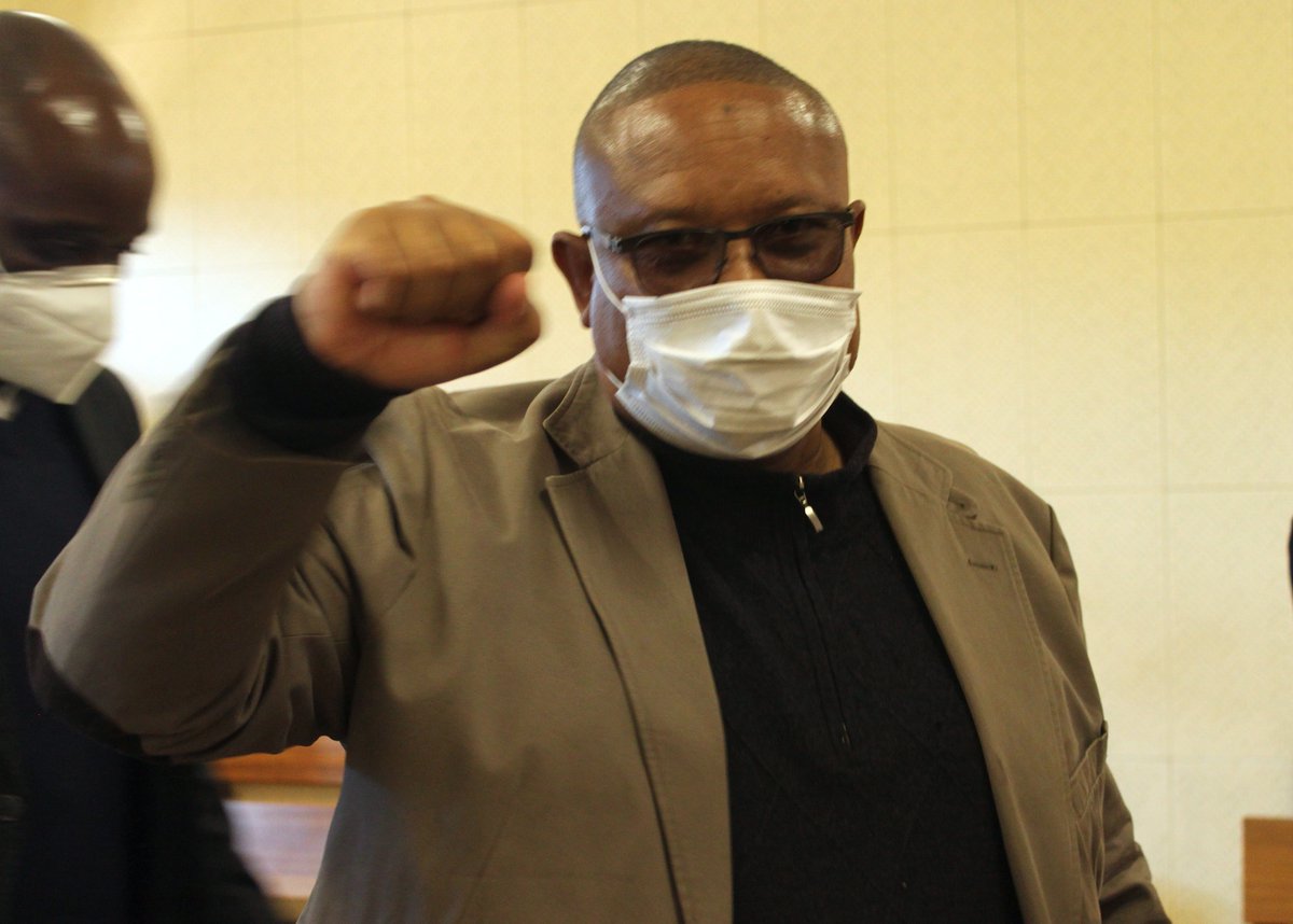 WernerMenges's tweet photo. Former fisheries minister Bernhard Esau and some of his amigos were back in the dock in the Windhoek Magistrate's Court on charges of corruption, fraud and money laundering today. Should I guess this photo means "Viva, Swapo, Viva!"? https://t.co/cjaJ95wEEK