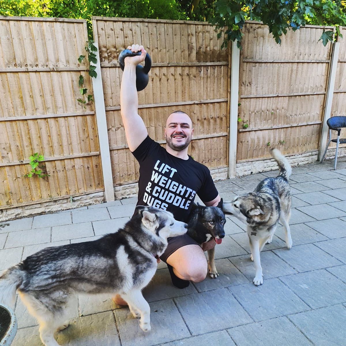 aekido's tweet photo. Designed a tee and got this sent from a customer. Perfect shot for the tee if I do say so myself! #liftweights #cuddledogs #scotland https://t.co/CR5mNmCacl