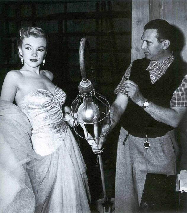 Ray NolanCinematographer Milton R. Krasner makes sure that Marilyn Monroe is lit properly. All eyes were on Marilyn in her scenes in All About Eve, 1950, early in her career.