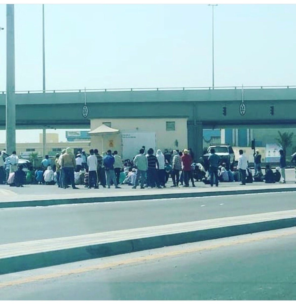 MigrantRights's tweet photo. Yesterday in #Bahrain, more than 100 migrant workers of Fundament SPC construction company staged a protest in Nuwaidrat near their camp due to non-payment of wages. The workers are owed up to 8 months of unpaid salaries and final settlement. https://t.co/Umux93ksaR