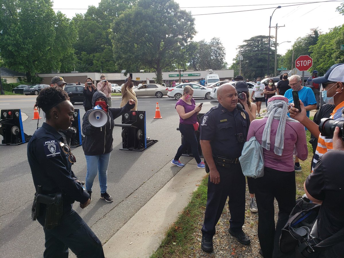 There about 10 officers out front milling about asking protesters individually if they'd like to talk.