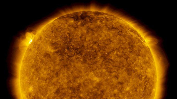 The Sun in ultraviolet light, with bright flares visible on the upper left limb