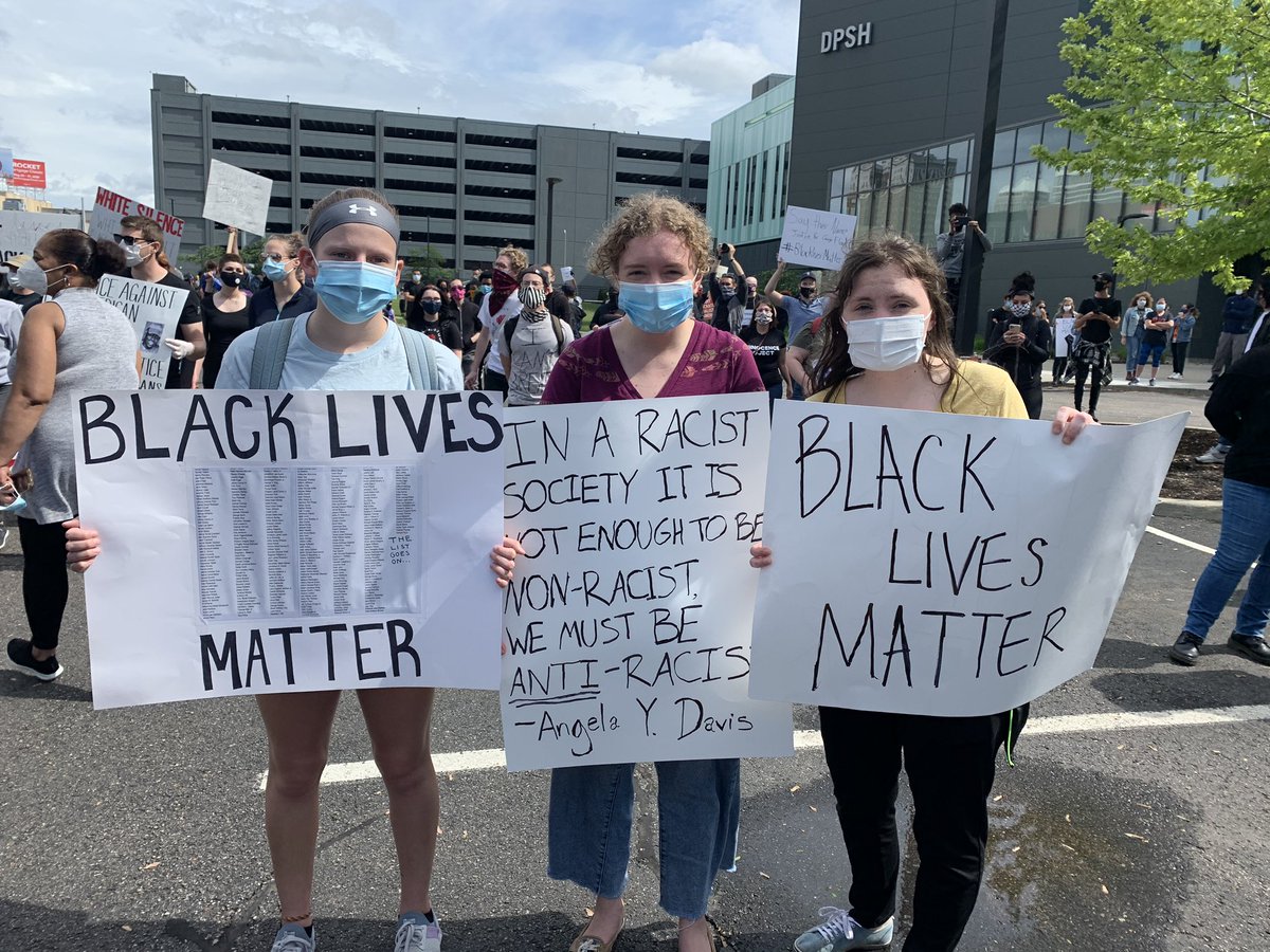 The crowd is mixed with Black and white supporters. Lauren Wasiak, Kaleigh Kuhns, Maggie Kuhns came down from Oakland County to support. They even quoted former Black Panther and political activist Angela Davis.