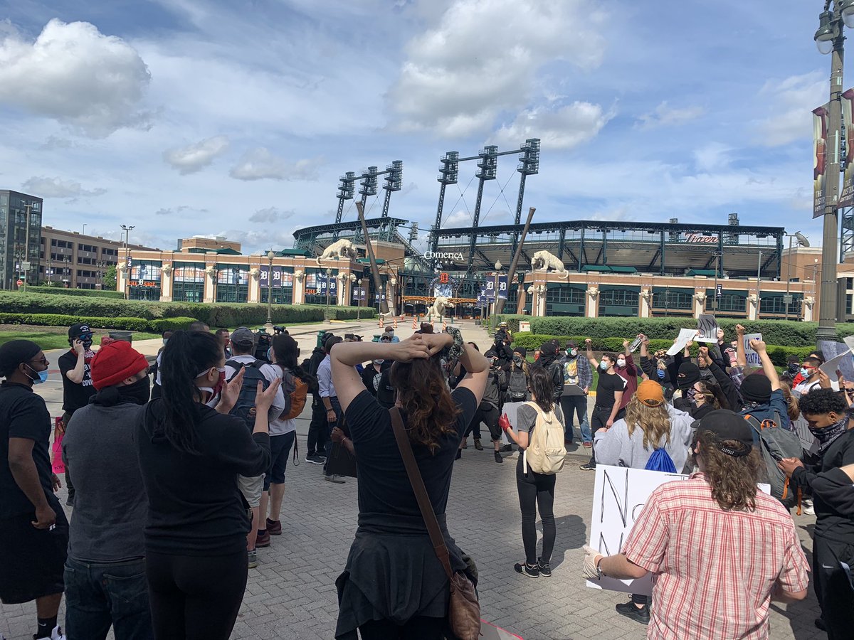 The northbound lane of Woodward Avenue is completely taken over by protesters in Detroit. They stopped to let others catch up. Has to go from Comerica Park back to Grand Circus. Large crowd in the hundreds. Not sure how the DDOT 4 bus will get through here.